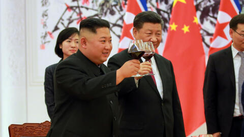 North Korean leader Kim Jong Un and Chinese President Xi Jinping raise a toast in Beijing, China, in this undated photo released June 20, 2018 