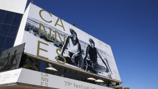 View of the official poster featuring actors Geena Davis and Susan Sarandon from Ridley Scott's road movie "Thelma & Louise" on the facade of the Festival Palace before the opening ceremony of the 79th Cannes Film Festival in Cannes, France, May 12, 2026. REUTERS/Manon Cruz